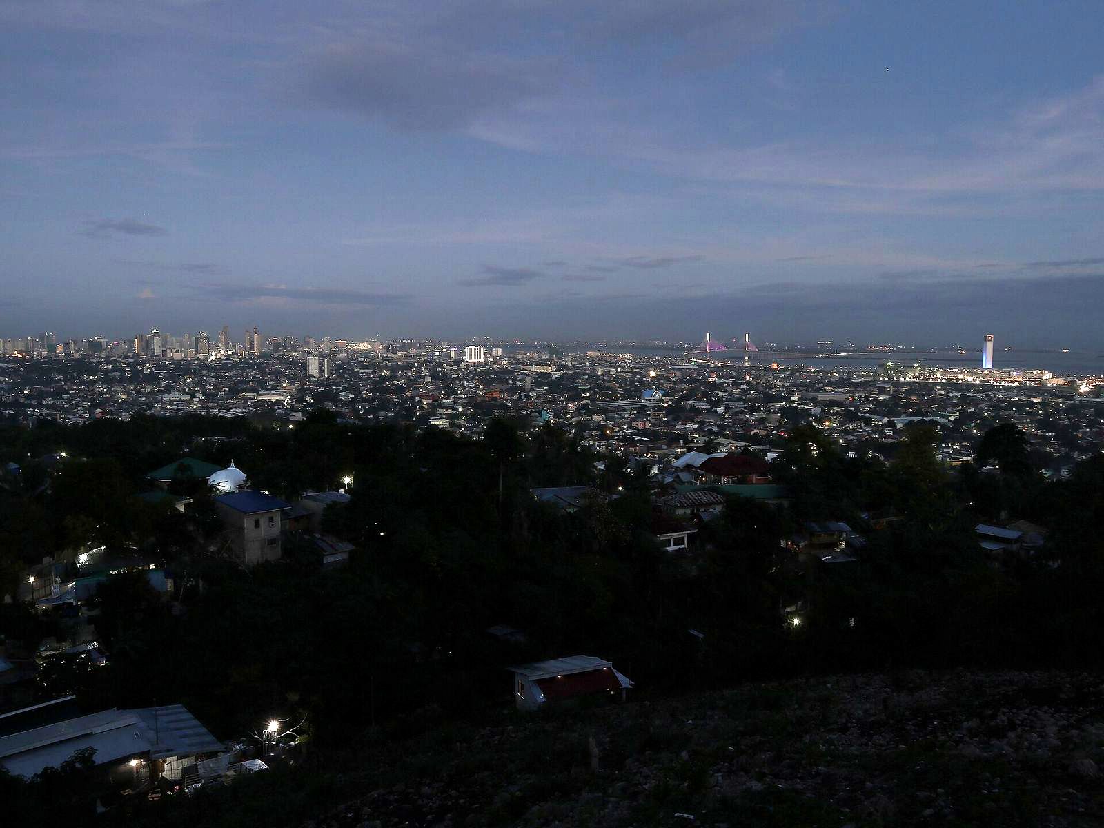 Cebu City at dusk seen from the surrounding hills